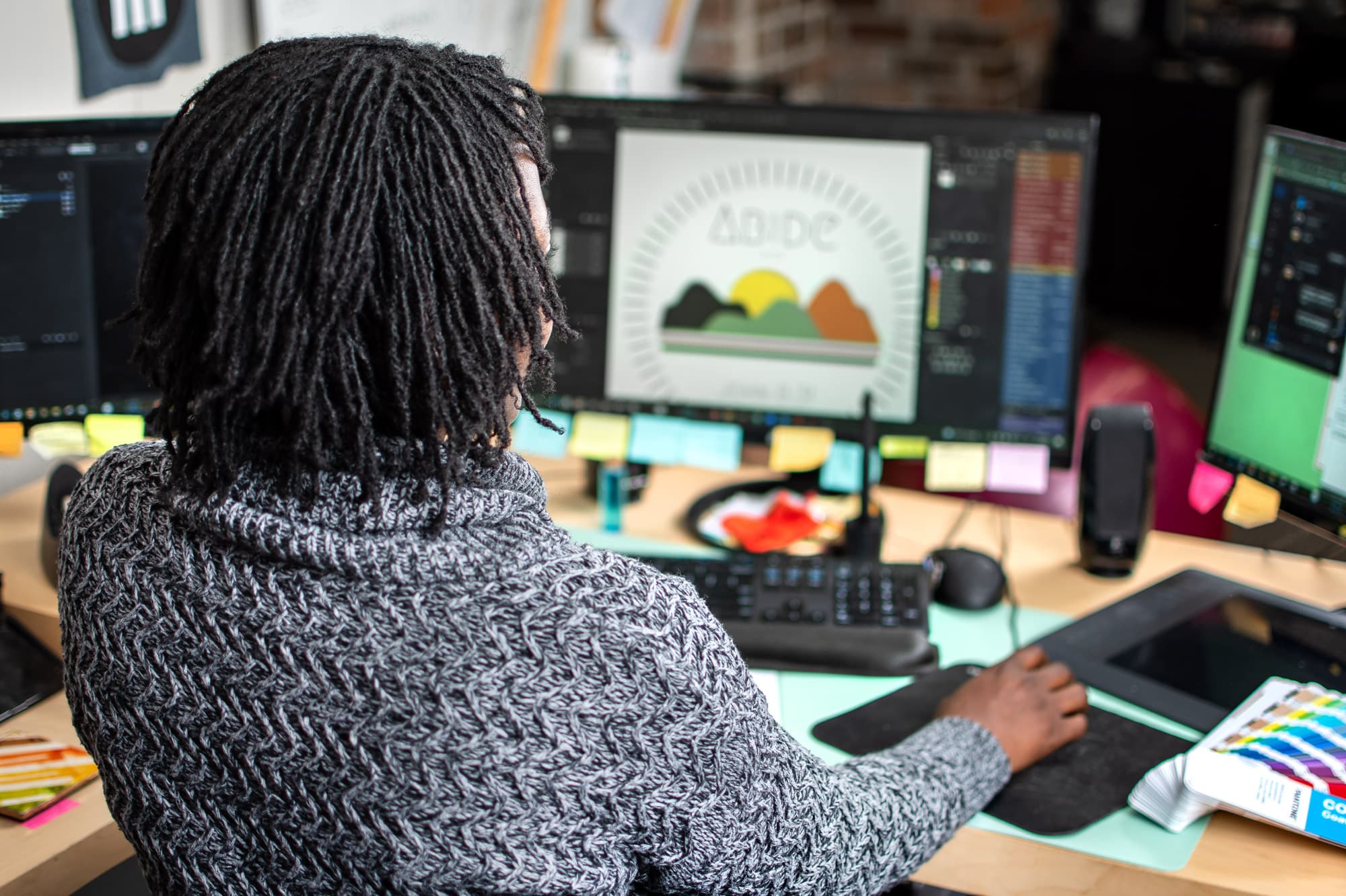 An image of one of our art department members reviewing a customers design.