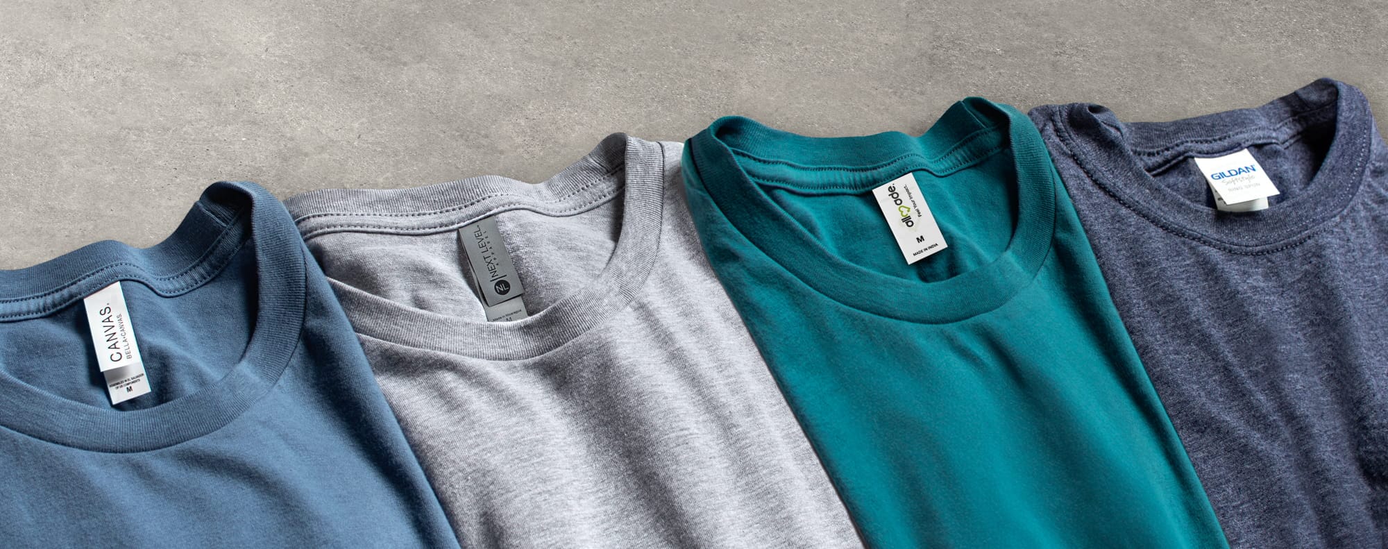 An assortment of different brands and style of t-shirts.