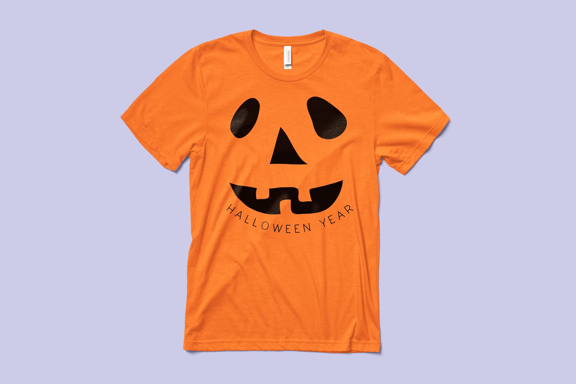 Image of an orange t-shirt with a customizable halloween design of a jack-o-lantern face.