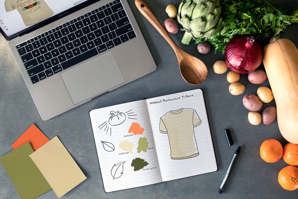 Top-down image of a restaurant business in the design process of creating their shirt