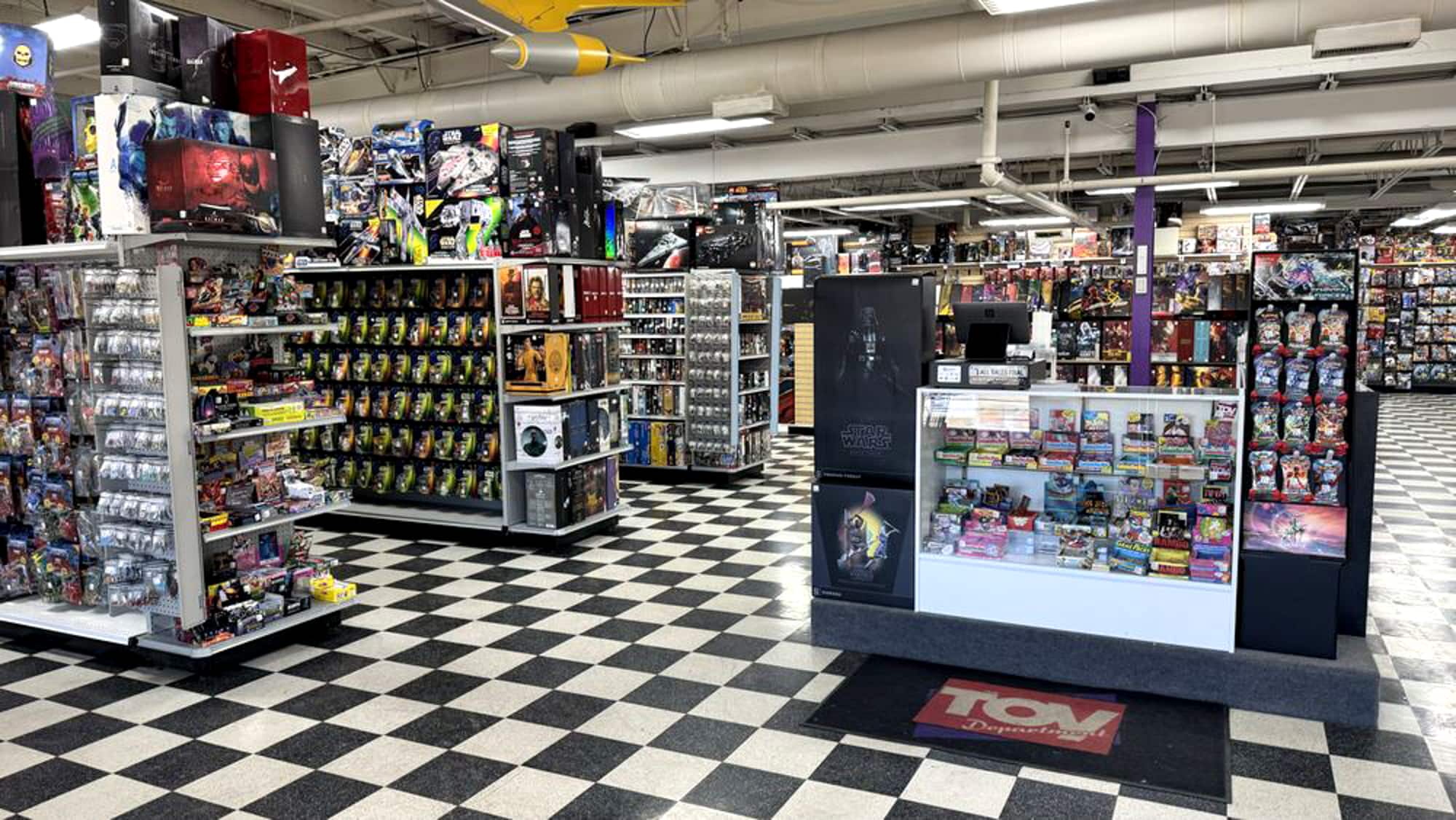 In-store photo showing toy shelves and the checkout counter.