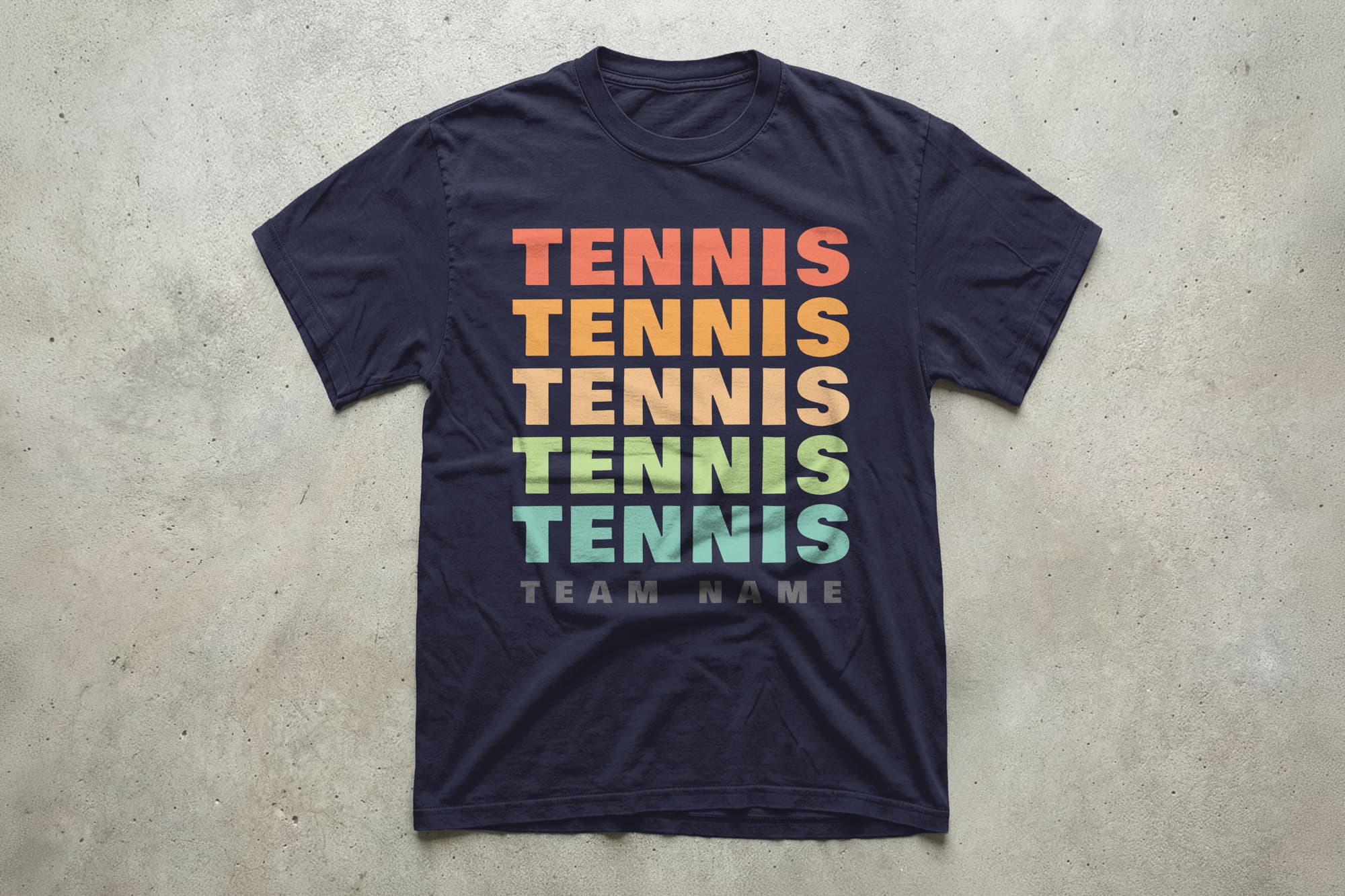 Navy blue T-shirt with the word "TENNIS" in a rainbow of colors stacked vertically, and "TEAM NAME" in gray at the bottom, creating a sporty and vibrant look.