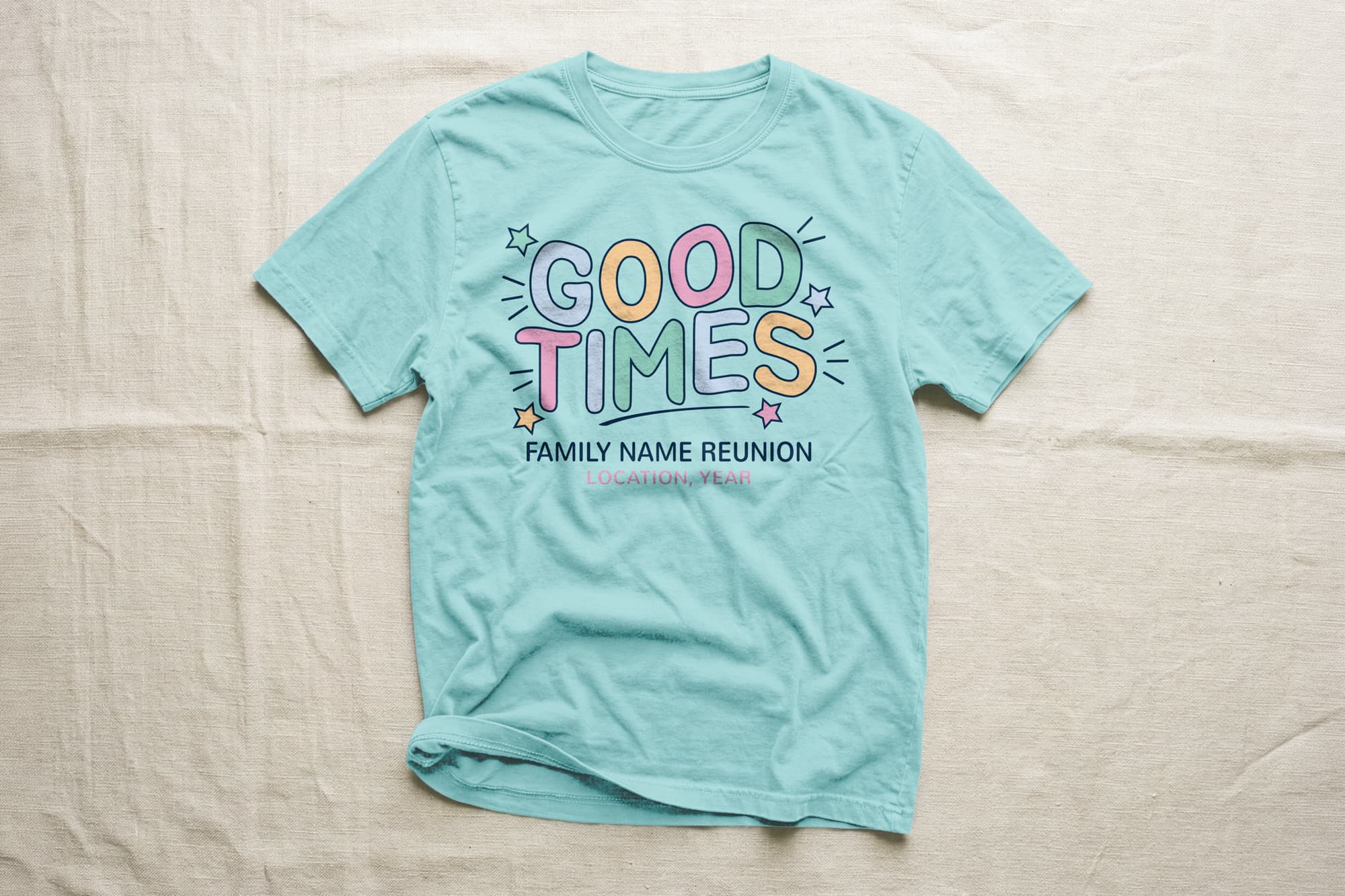 Light blue T-shirt with colorful "Good Times" print surrounded by stars. Below, it reads "Family Name Reunion" and "Location, Year." Bright and cheerful tone.