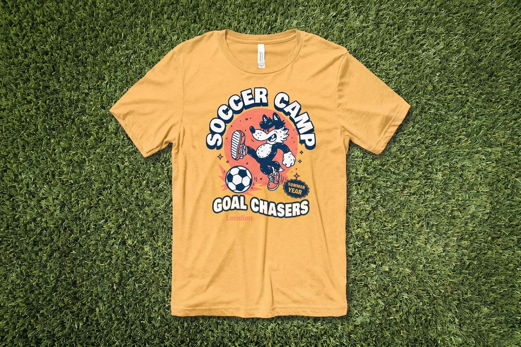 Yellow T-shirt on grass featuring "Soccer Camp Goal Chasers" text, cartoon wolf kicking a soccer ball, playful and energetic design.