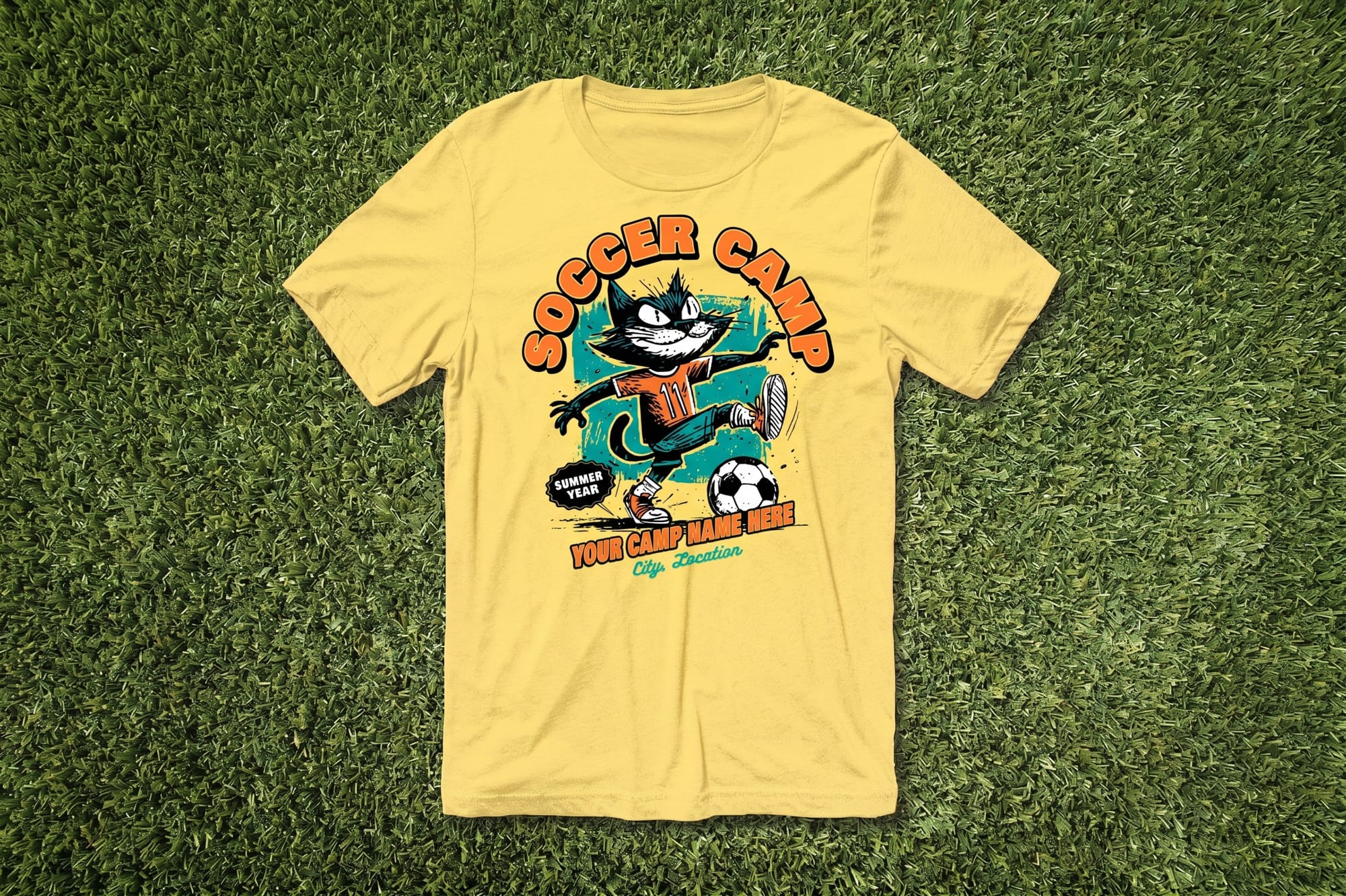 Yellow T-shirt with "Soccer Camp" text and a cartoon cat kicking a soccer ball. Set on grass, it has a playful and sporty vibe.