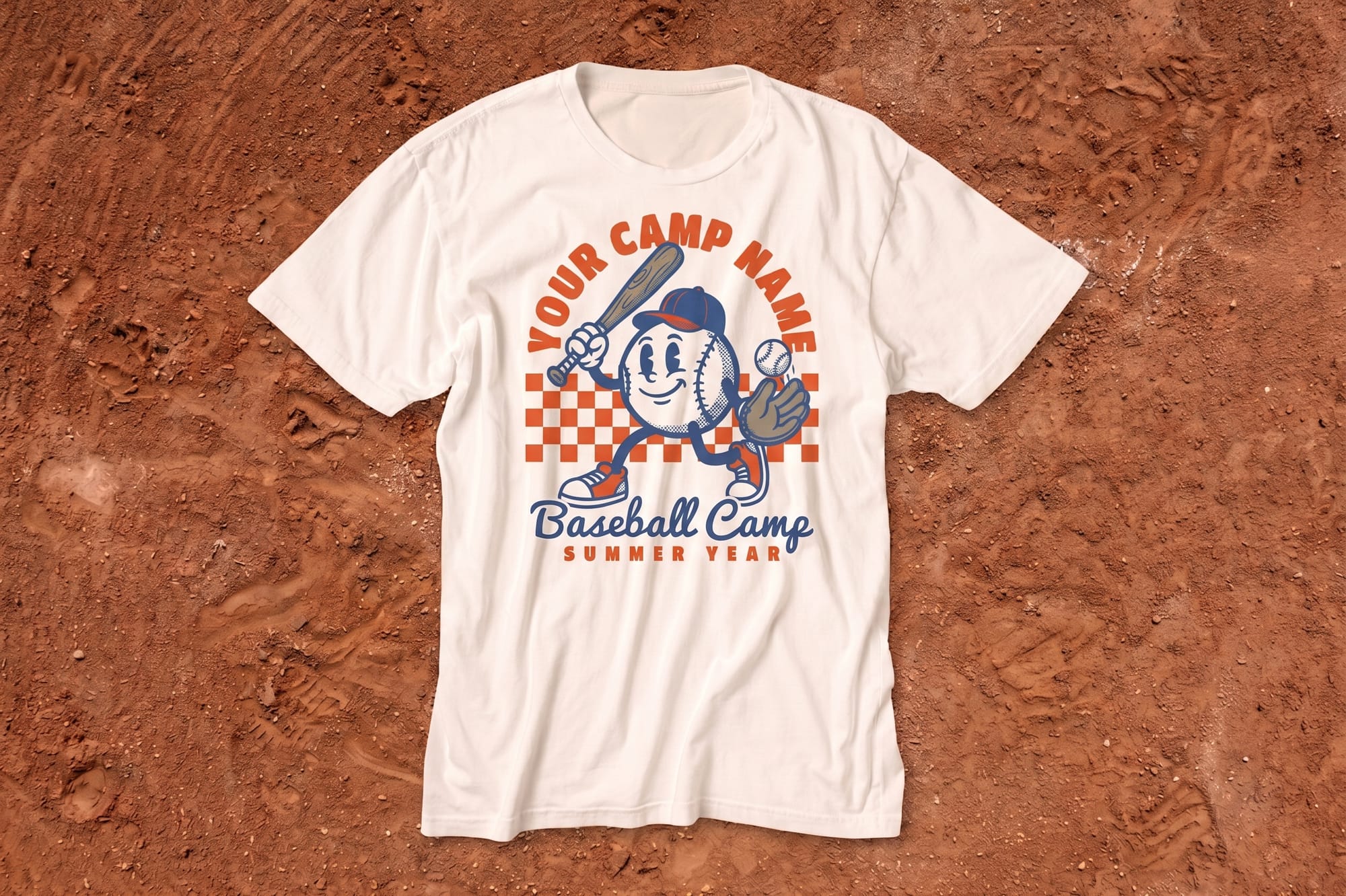White T-shirt on red dirt, featuring a retro cartoon baseball character with a bat and glove, text reads "Your Camp Name, Baseball Camp, Summer Year."