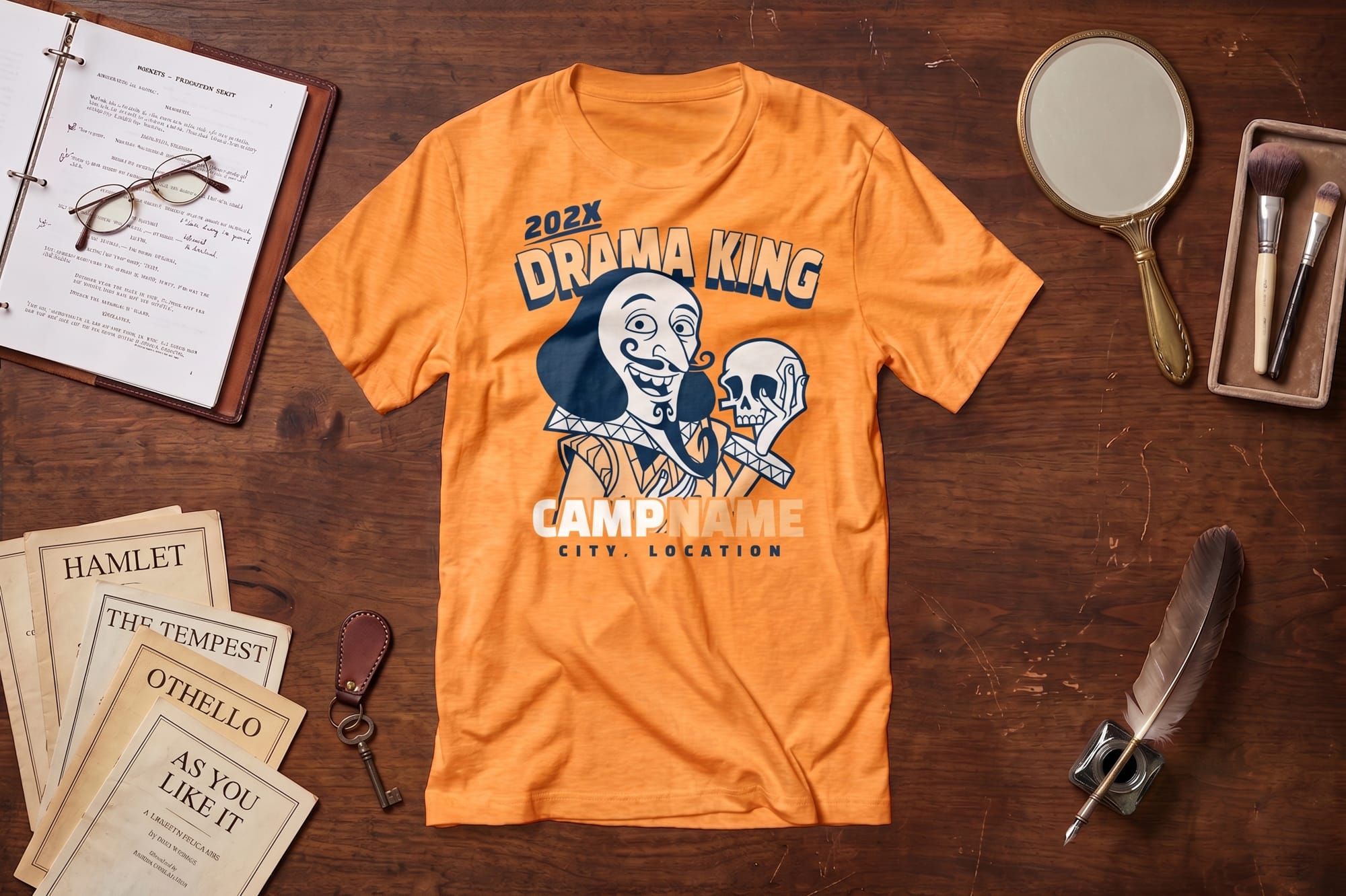 Orange custom t-shirt with a Shakespeare-style 'Drama King' screen-printed design, styled in a flatlay with play scripts.