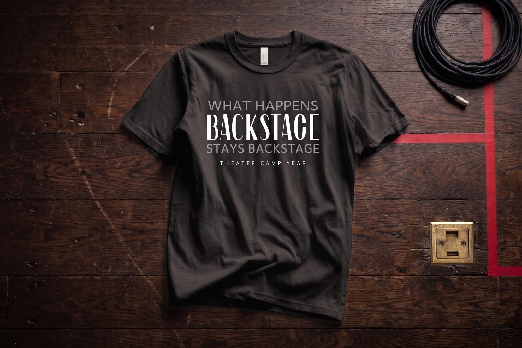 Dark charcoal crewneck tee with 'What Happens Backstage Stays Backstage — Theater Camp Year' custom print