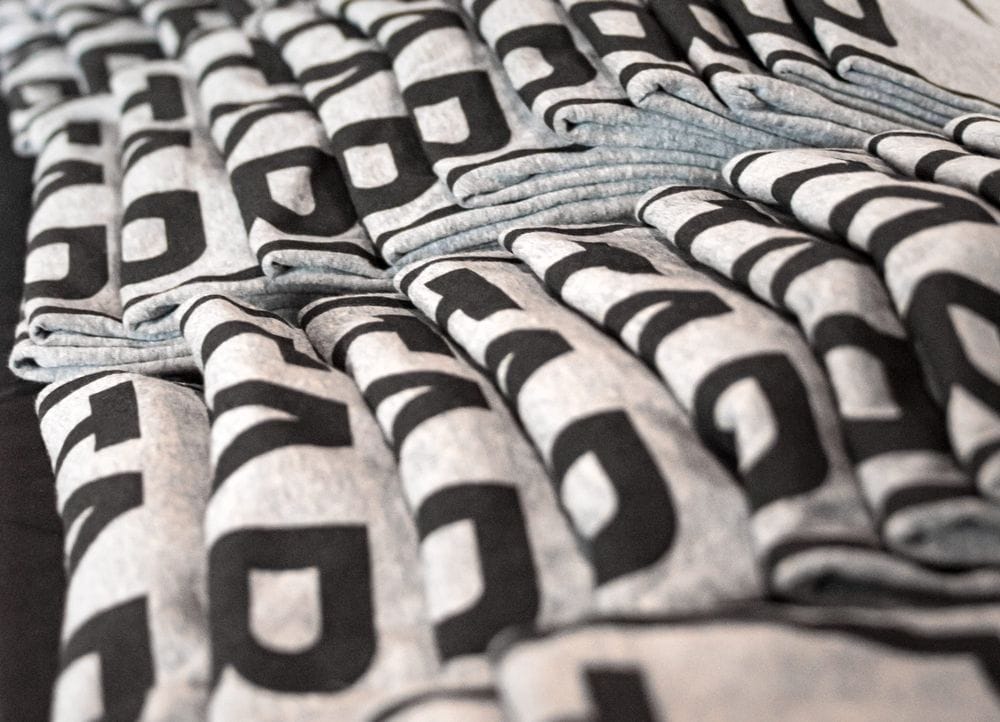 Image of t-shirt giveaway table at event.