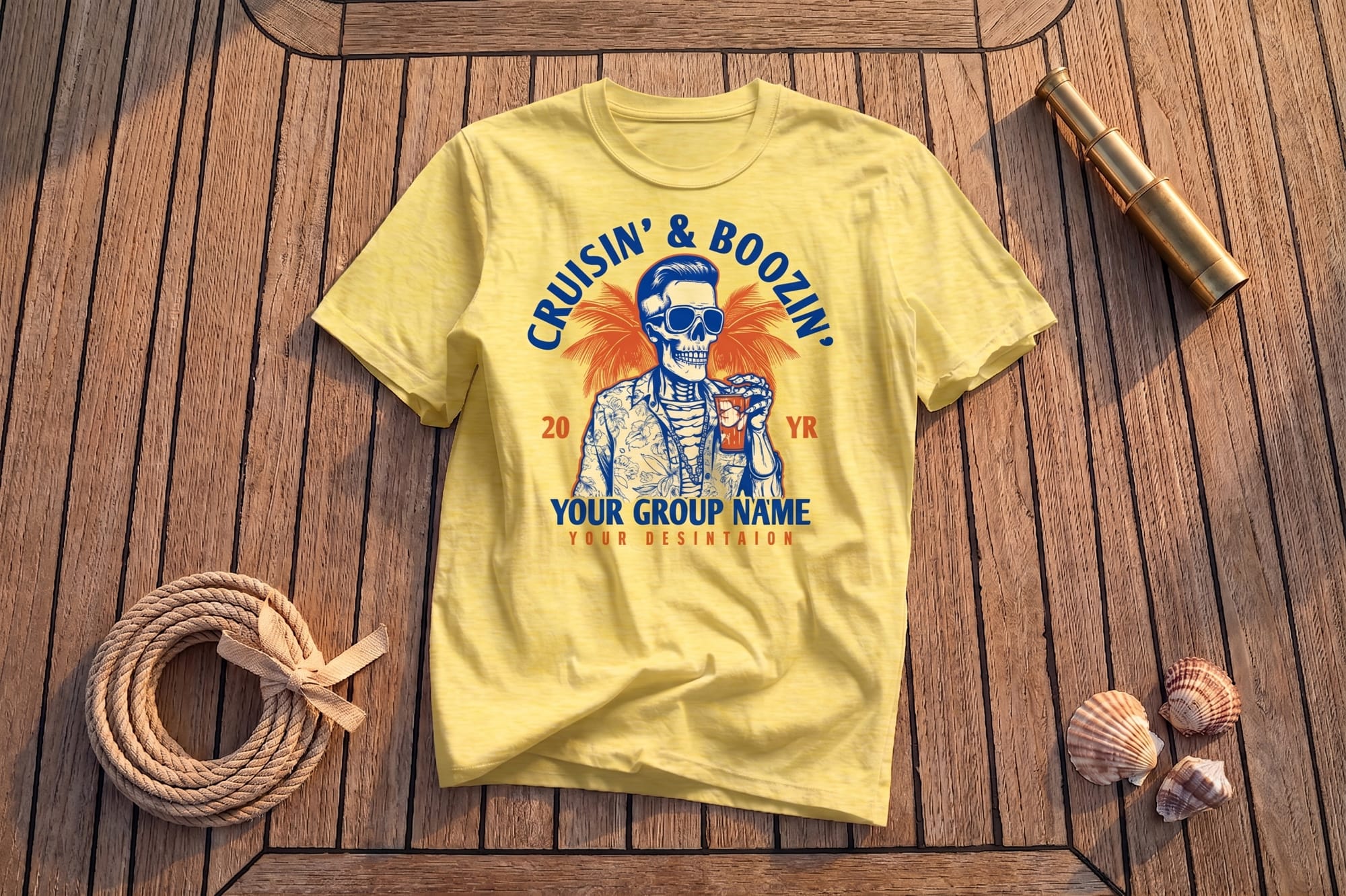Yellow crewneck t-shirt with a retro skeleton graphic and 'Cruisin' & Boozin'' cruise group design, flatlay on wood deck