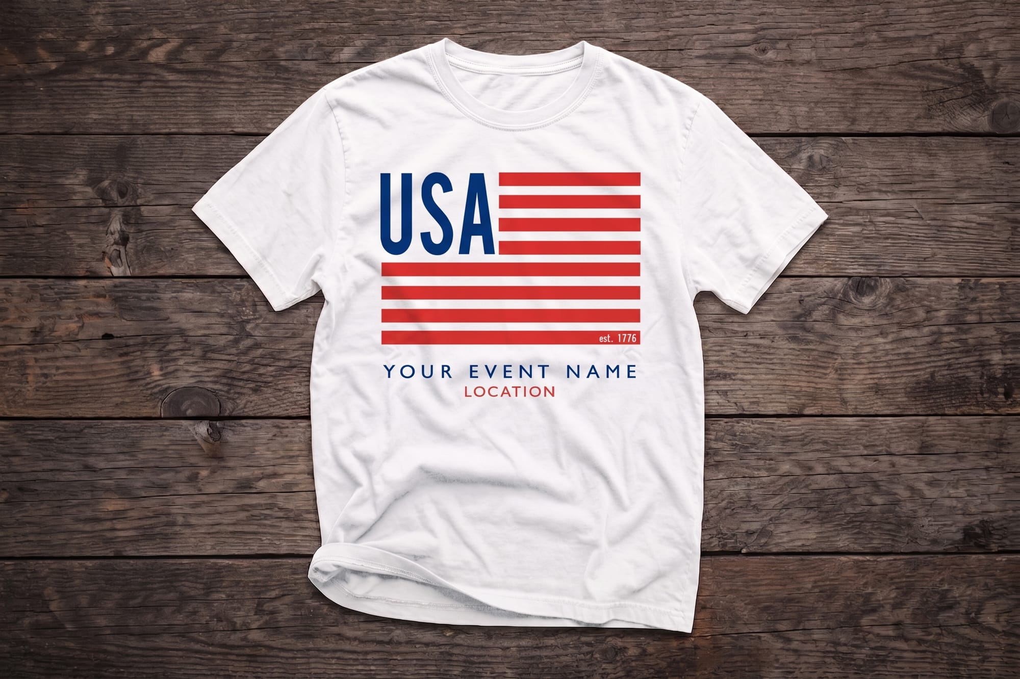 White crewneck t-shirt with a custom-printed red, white, and blue USA flag design and personalized event name placeholder