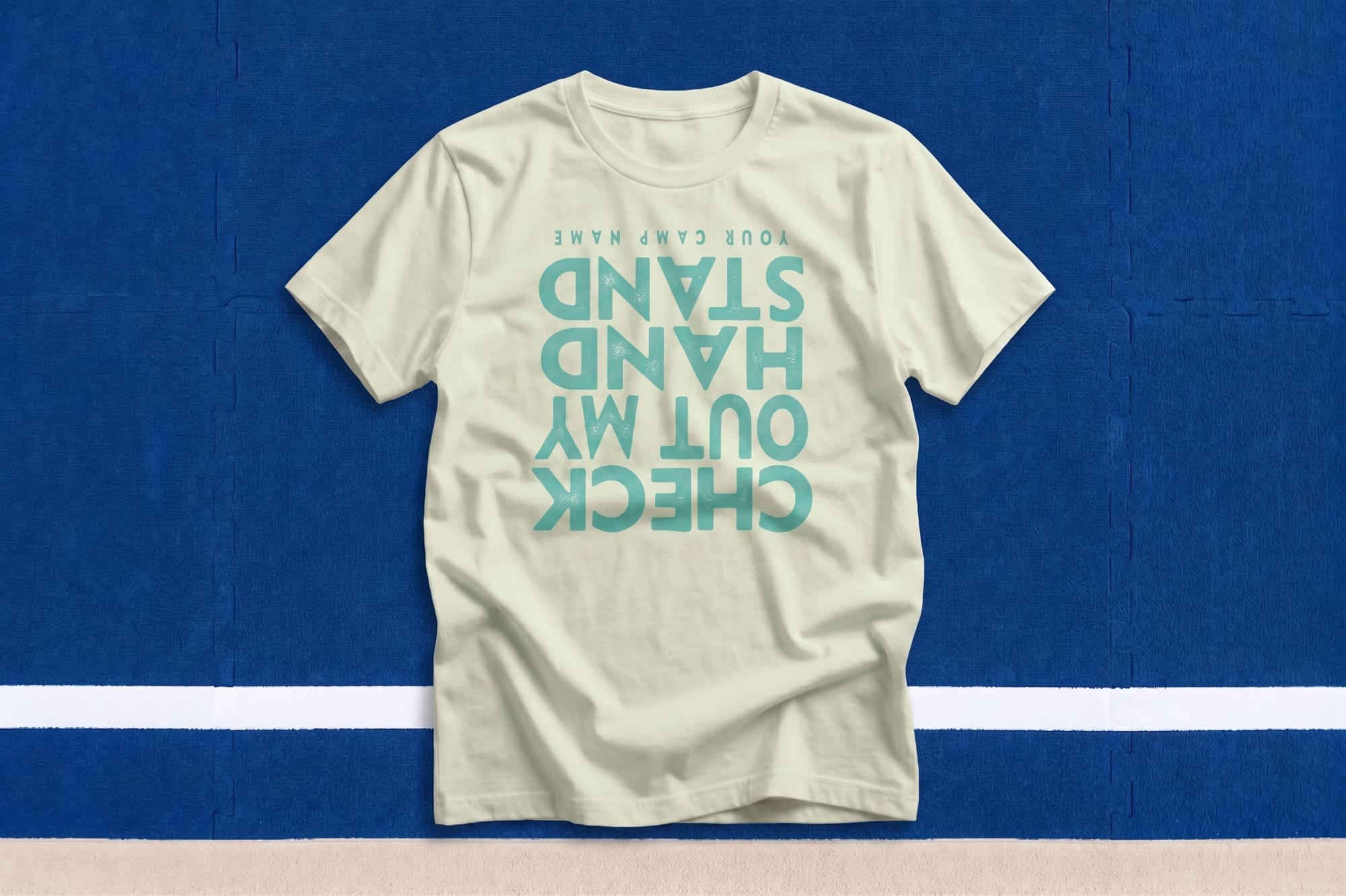Natural crewneck tee with teal upside-down 'Check Out My Stand' custom-printed text — camp shirt design