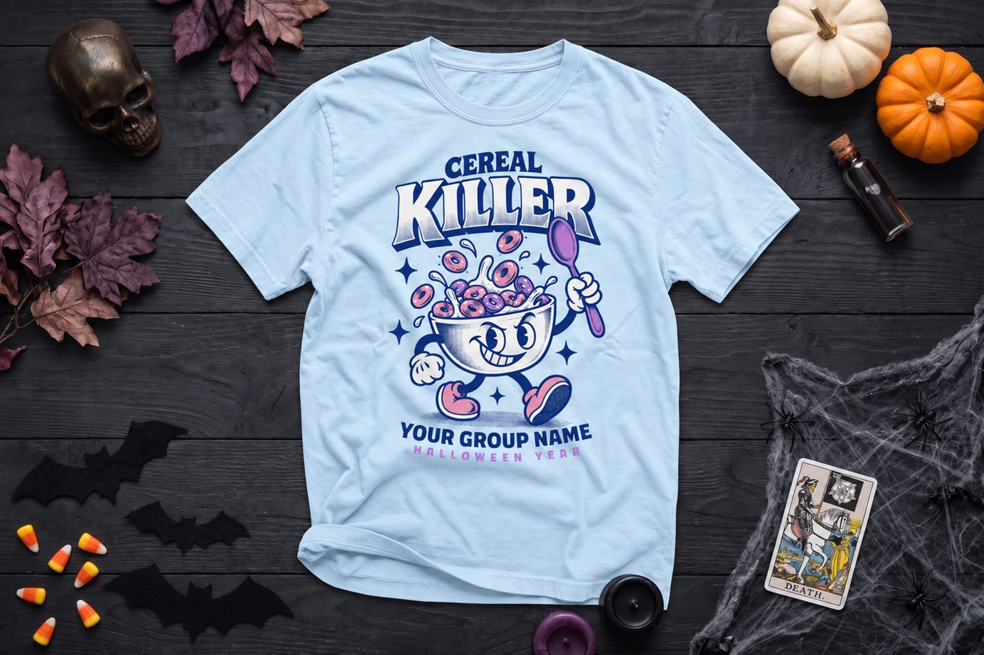 mockup of a halloween flatlay shirt. design is of a cereal bowl character and it says cereal killer