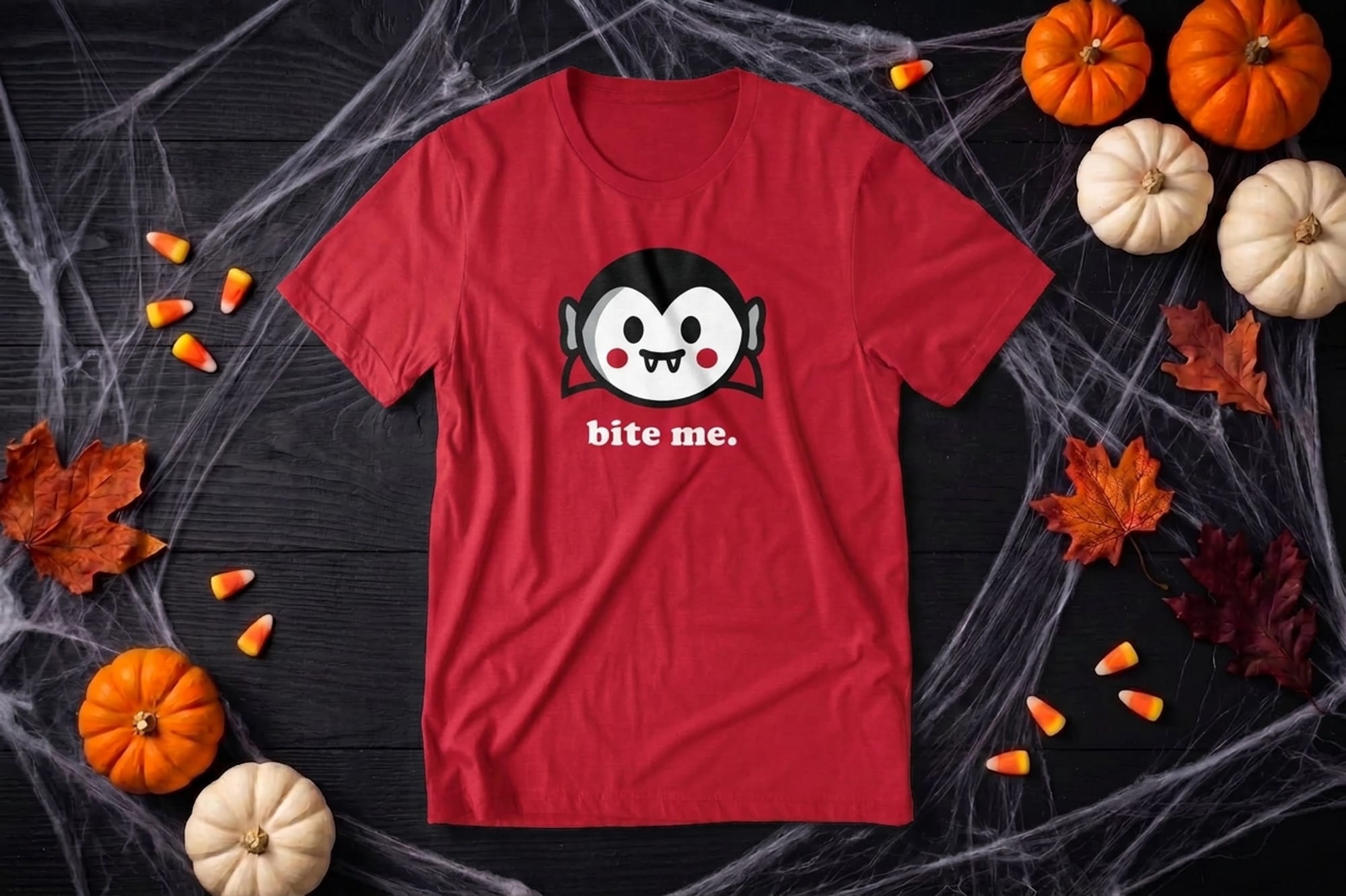 Red t-shirt template with a cartoon vampire face and the phrase Bite Me