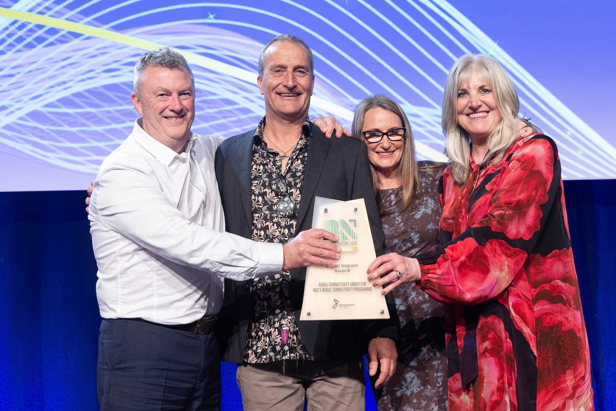 RCG's Ian Hooker, CEO, Steven Waters, Allison Bailie and Caitlin Metz with the Social Impact Award. 