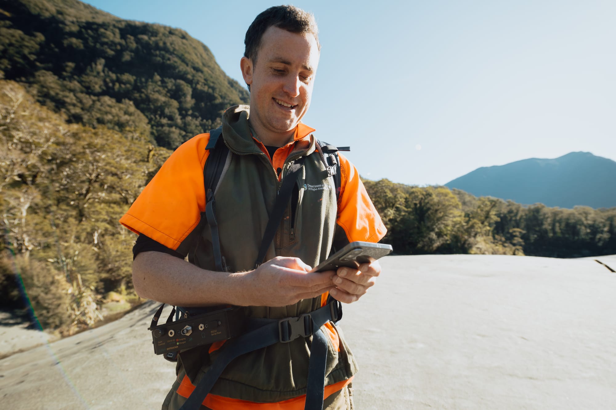 DOC Ranger Heath Sinclair using One NZ Satellite TXT in Haast.