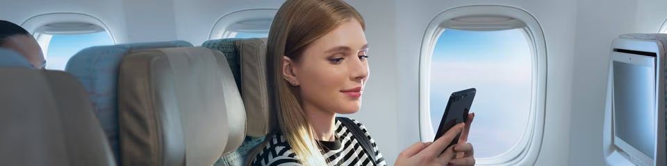 woman-using-onboard-wifi-on-phone