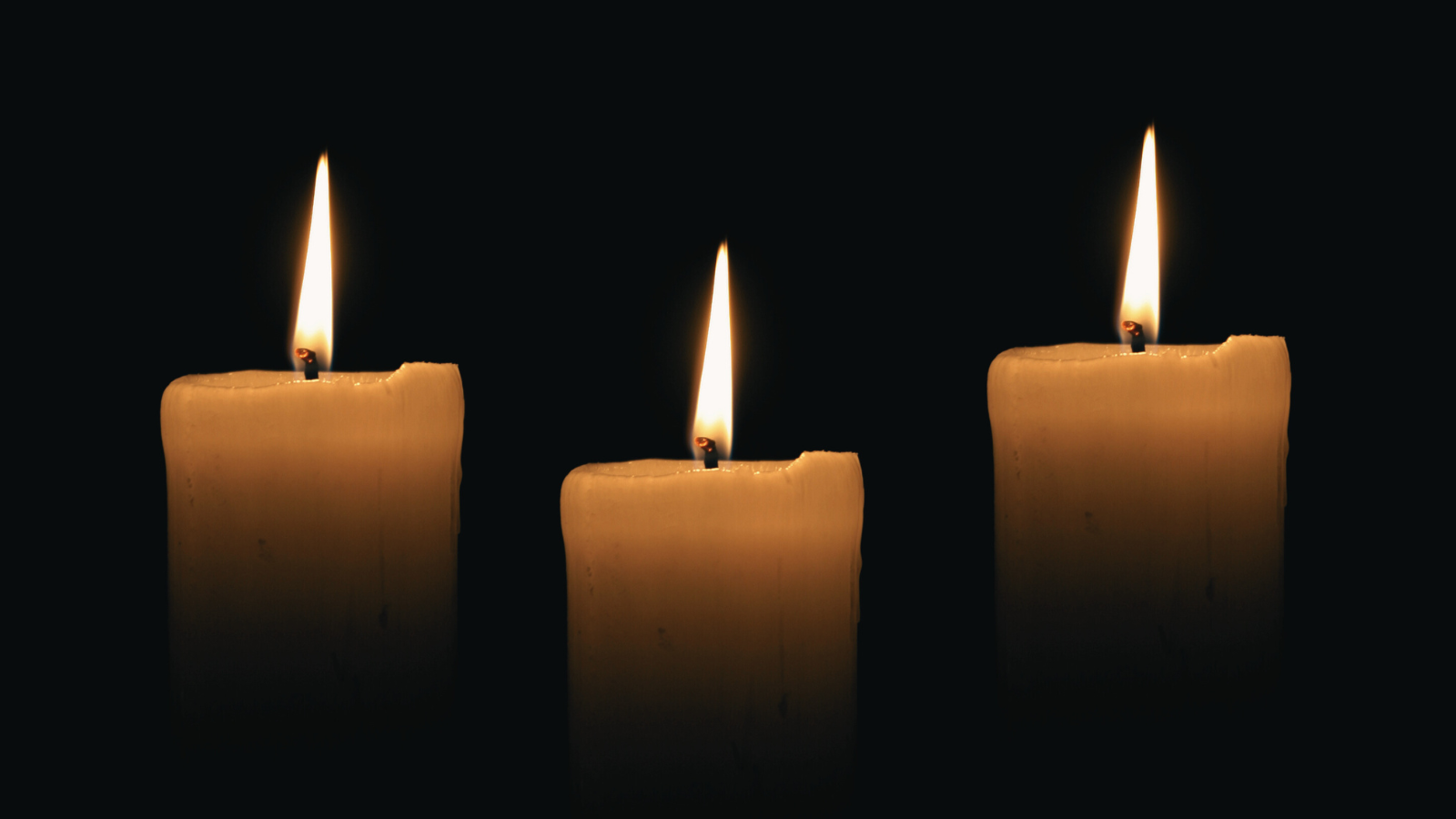 Three candles in memory of Ozzy Osbourne, Malcolm-Jamal Warner, and Hulk Hogan