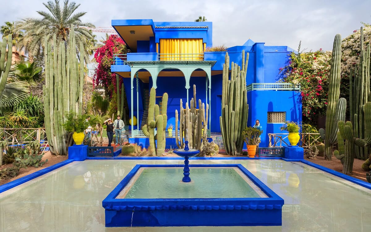 Bright blue Jardin Majorelle building with a central fountain, cactus garden, and geometric Moorish details in Marrakech