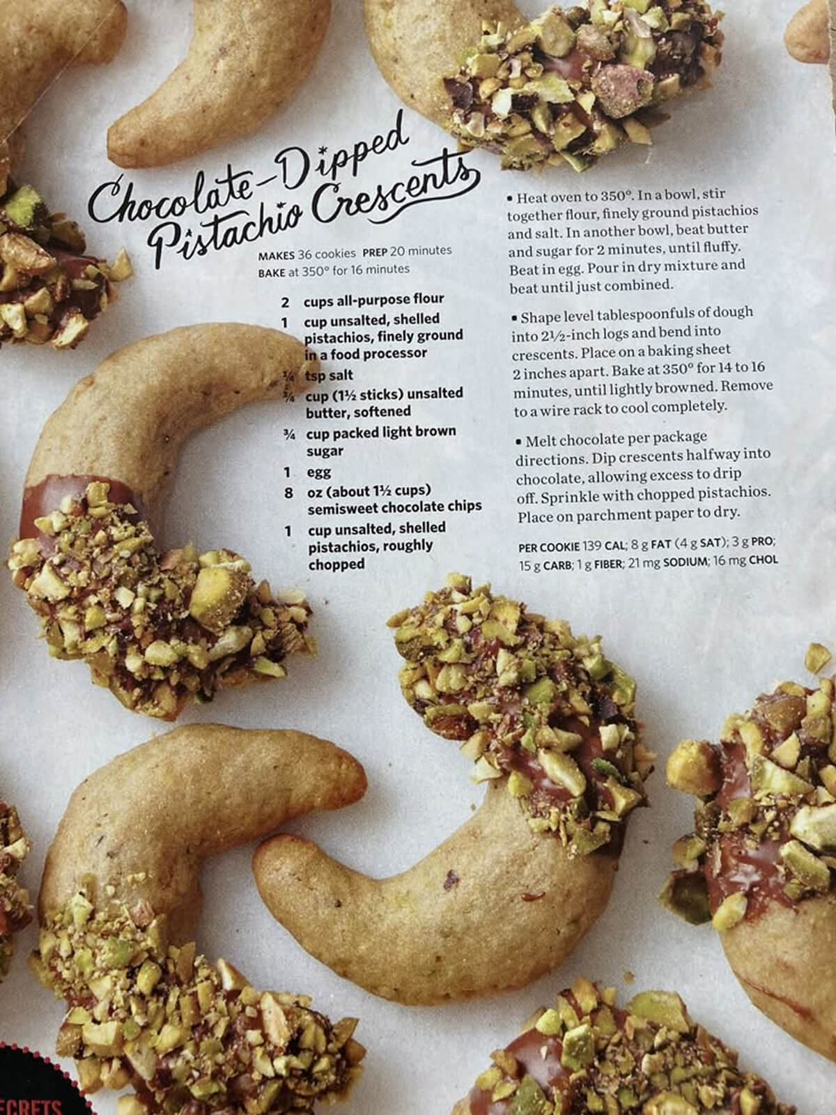 Chocolate-dipped crescent cookies topped with chopped pistachios, styled for Ramadan.