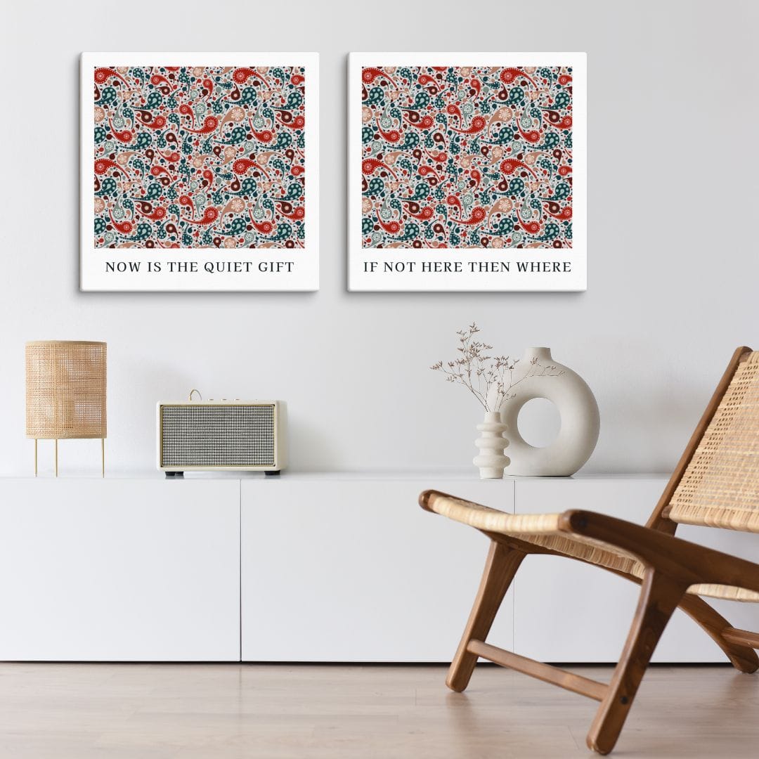 Contemporary Islamic quote art with paisley motifs in a modern living room setting; matching prints reading “Now Is the Quiet Gift” and “If Not Here Then Where.”