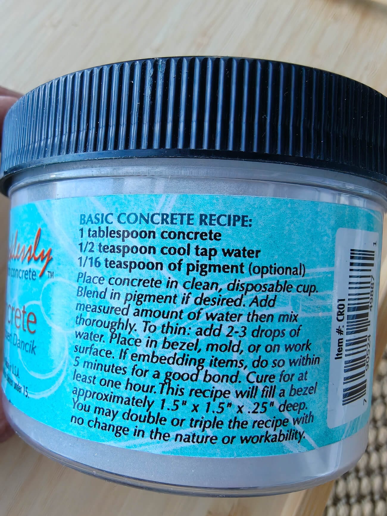 Artist’s concrete container showing the basic mixing recipe used for a DIY concrete candleholder