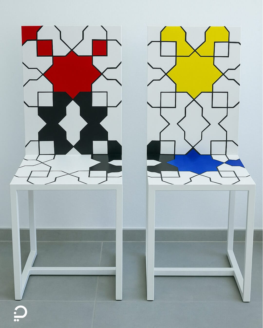 Modern chairs featuring Islamic geometric patterns and bold primary colours inspired by Mondrian, displayed in a minimalist interior