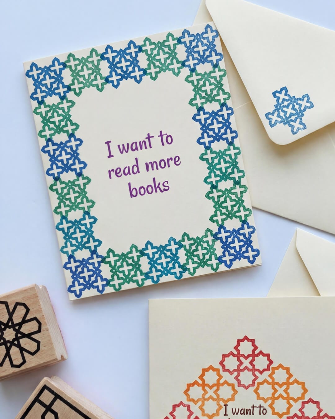 Ramadan intention envelopes stamped with Islamic geometric patterns, holding children’s written reflections and goals.
