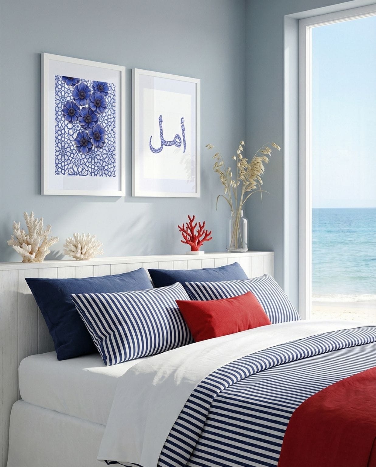 Blue geometric lace Islamic wall art and Amal calligraphy framed above a white bed in a light coastal bedroom with ocean view.