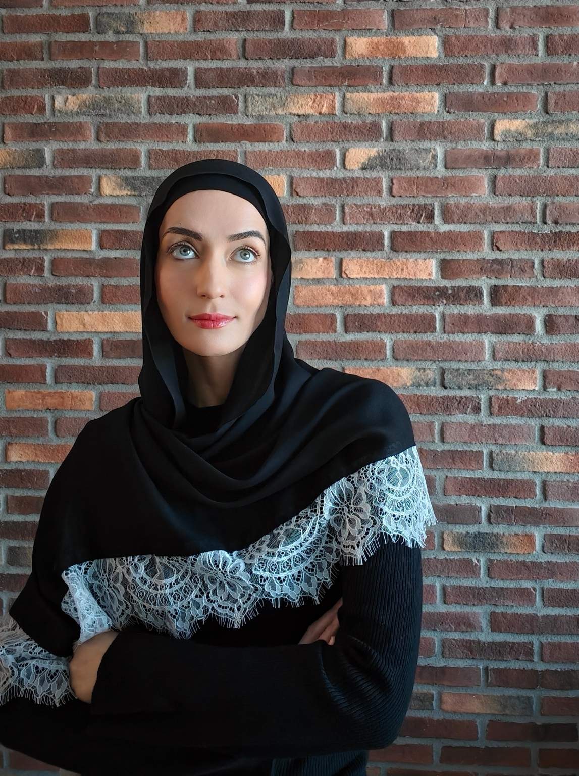 Close-up of a black modal hijab with lace hijab styled for a modern modest outfit