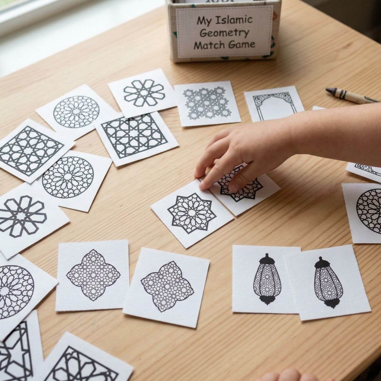 child matching islamic geometric pattern tiles in a printable memory game activity