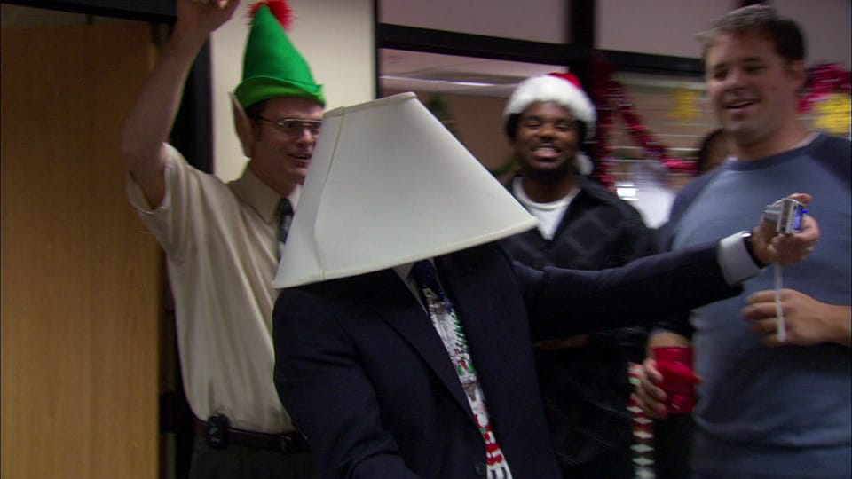 Michael Scott in The Office wearing a lampshade on his head.