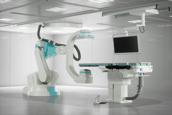 Stock image of a robotic-assisted surgery system in a hospital operating room.