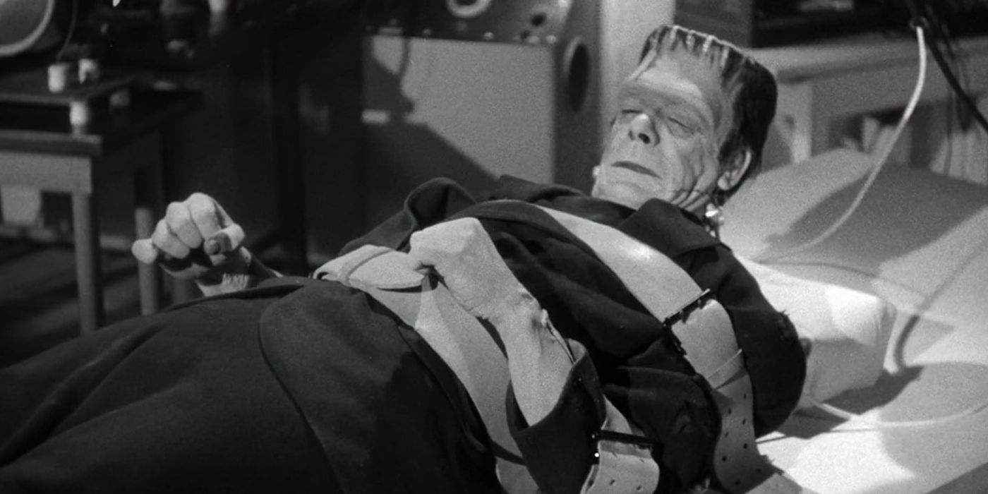 imagem do monstro de frankenstein amarrado a uma cama (visual clássico do filme de 1931)