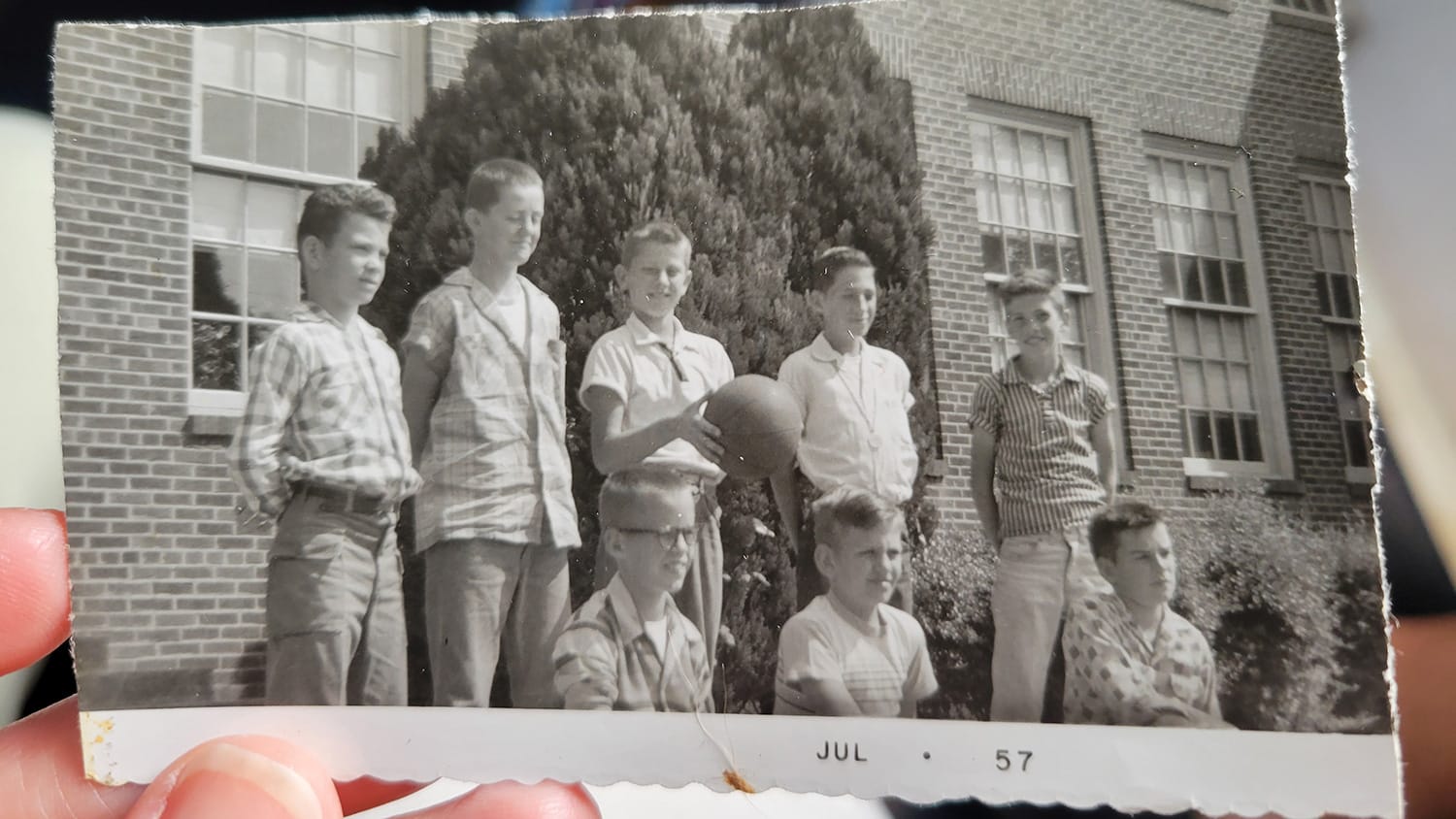 Steve Spurrier, holding a basketball, poses beside a group of childhood friends in Johnson City.