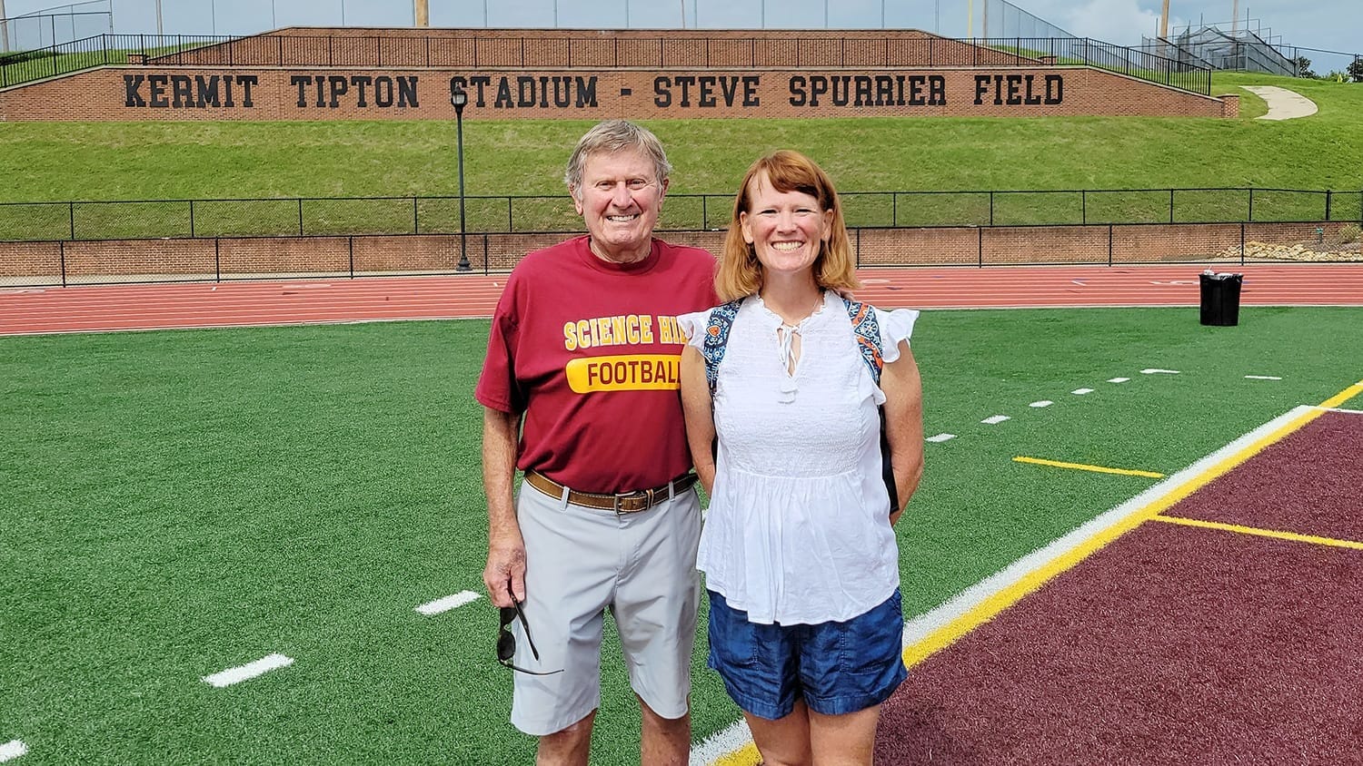 Steve Spurrier and his daughter, Amy Moody, stand on Steve Spurrier Field at Science Hill High School in Johnson City, Tennessee.