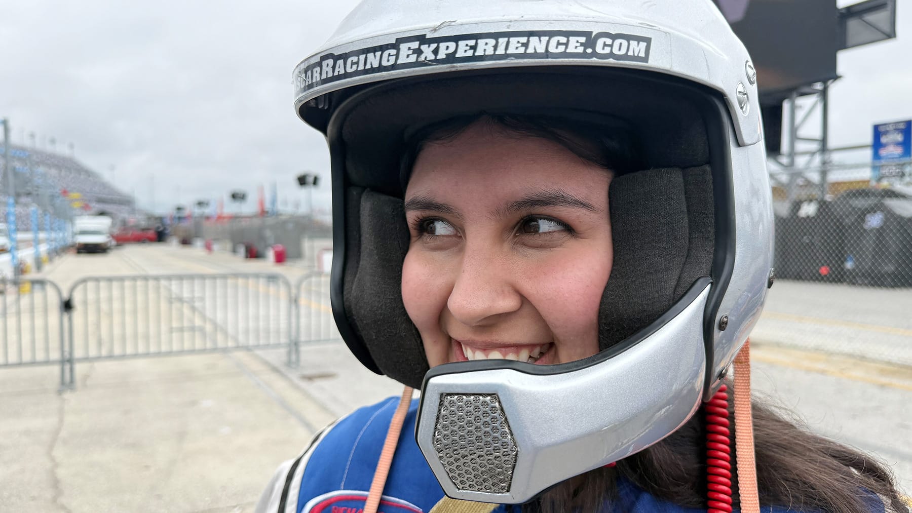 Grandstand Magazine staff writer Jessica Garcete eagerly looks on before the NASCAR Racing Experience at Daytona International Speedway on Feb. 12, 2026.