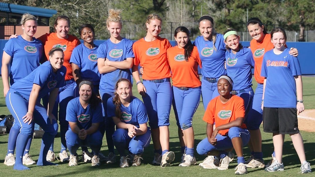 The Florida softball team poses with Heather Braswell at Katie Seashole Pressly Stadium sometime between 2009 and 2014.