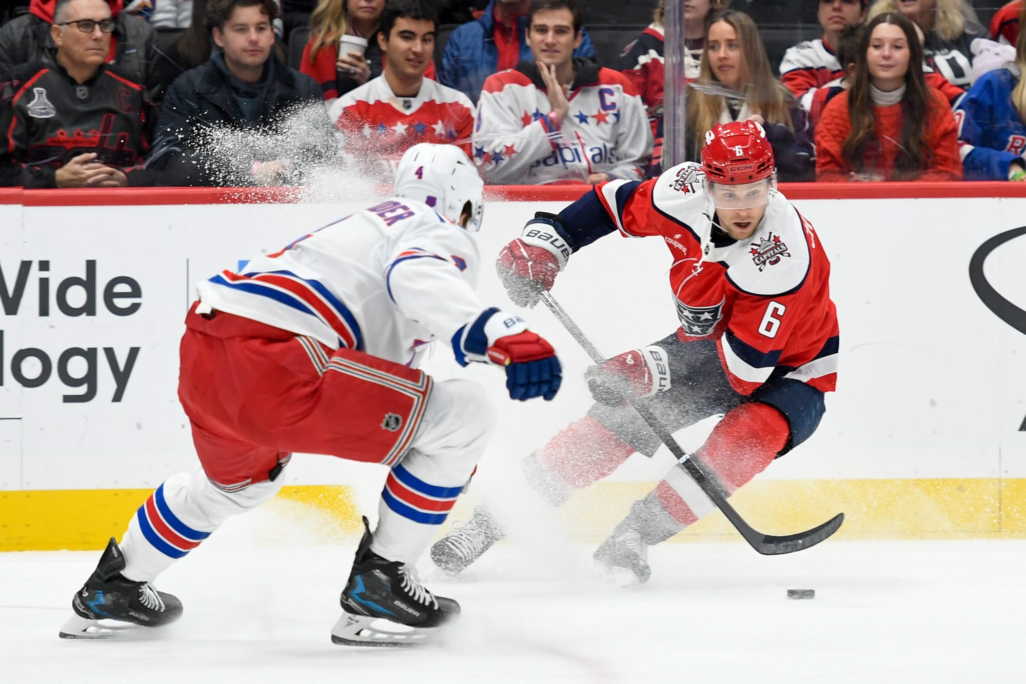  Jakob Chychrun (6) sprays a Rangers player with ice as Chychrun tries to skate away with the puck