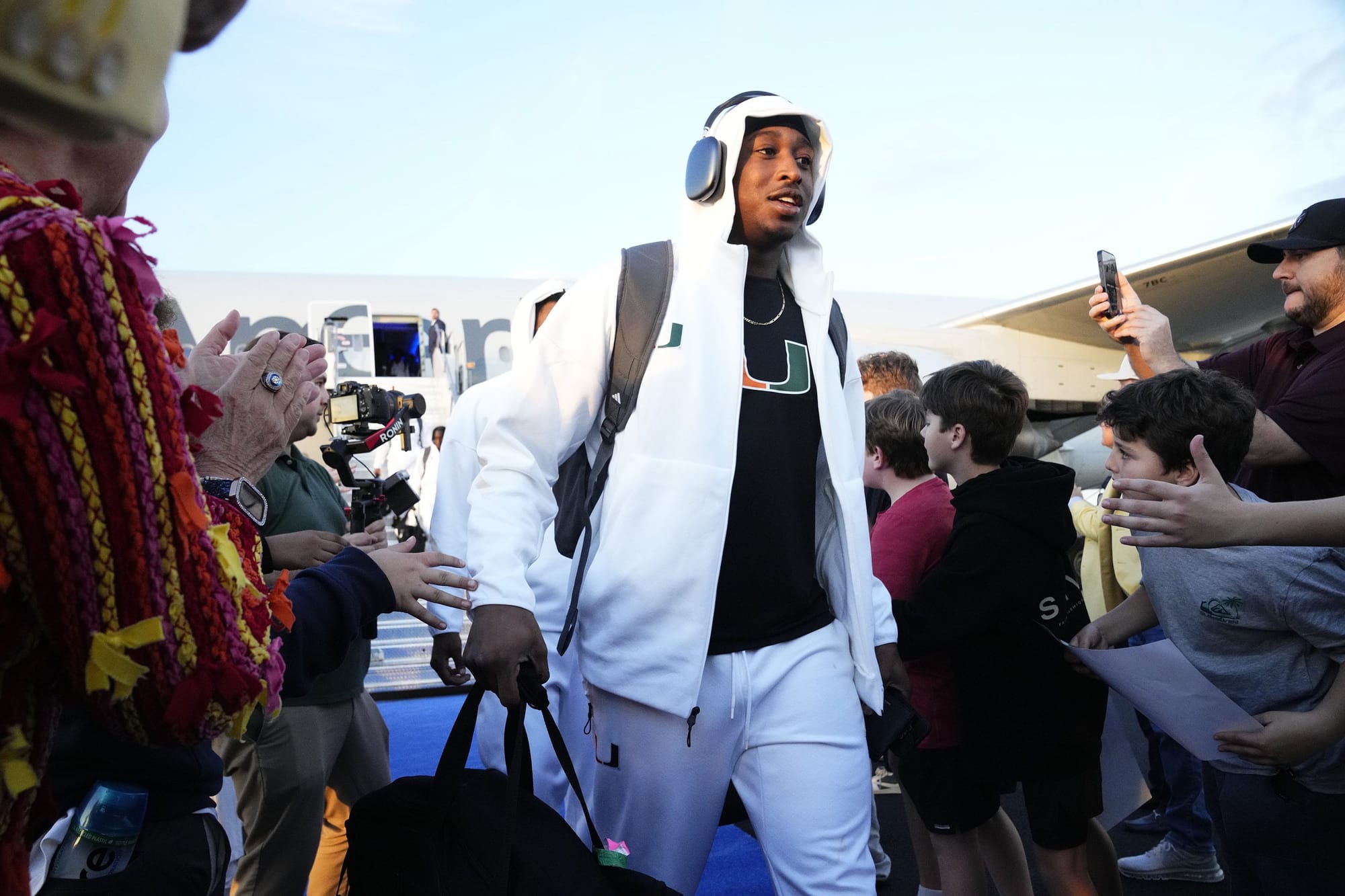 The Miami Hurricanes arrive at Phoenix Sky Harbor International Airport on Jan. 5, 2026, ahead of their matchup with the Ole Miss Rebels at the 2026 Vrbo Fiesta Bowl, which is a College Football Playoff semifinal game.