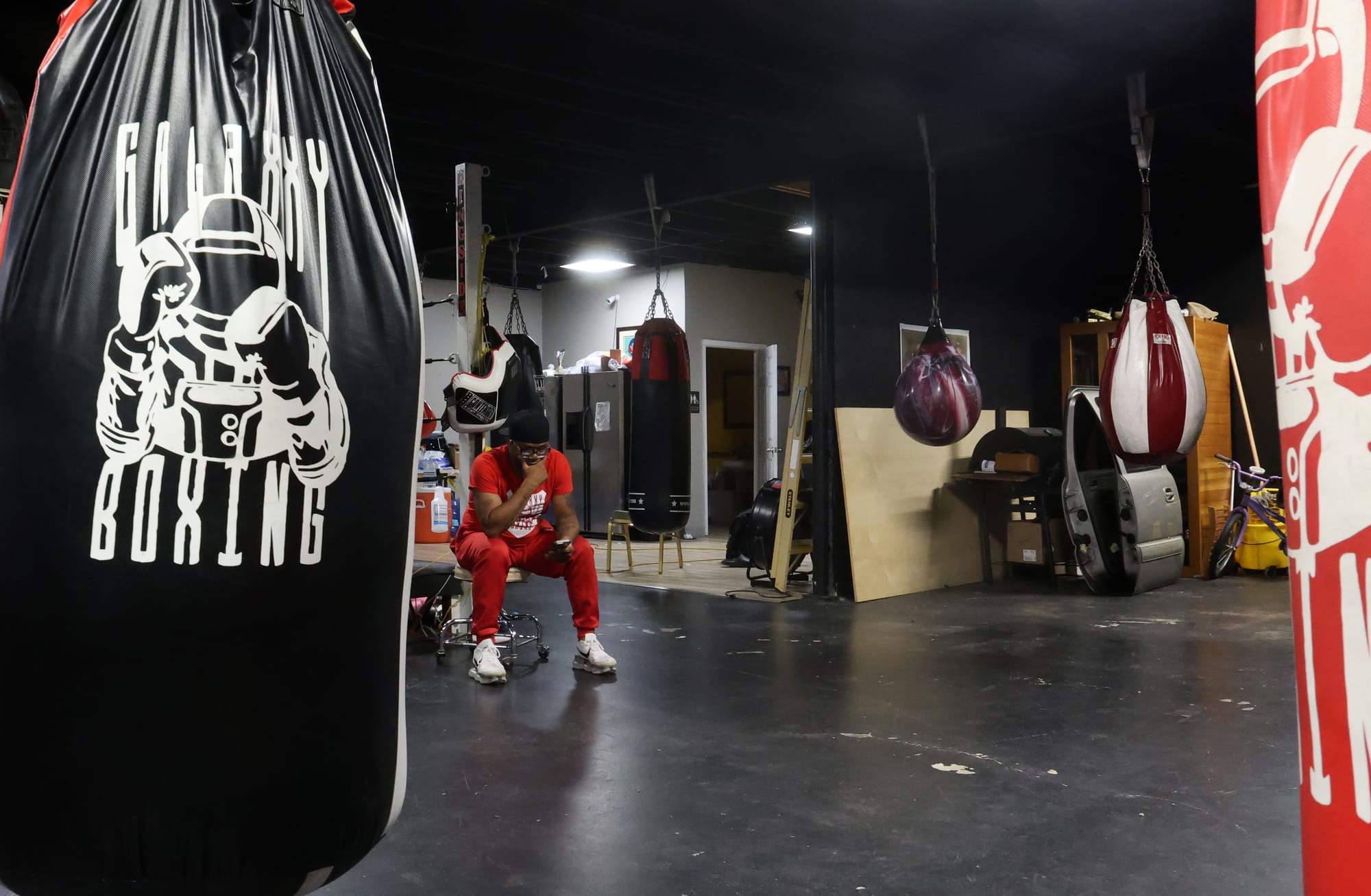 Nate Campbell sits alone in Galaxxy Boxing Refuge in Jacksonville after a long training night on Thursday, April 23.