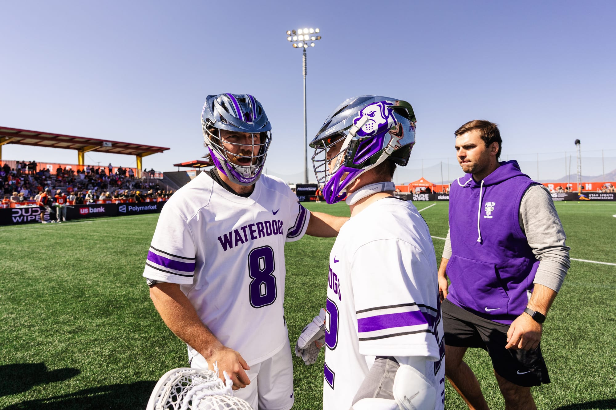 Philadelphia Waterdogs lacrosse defender Dylan Hess interacts with a teammate during a PLL game in 2024.