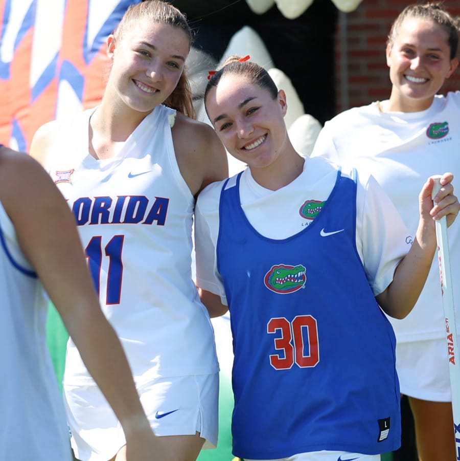 Carly and Sydney Wilson pose together before a Florida lacrosse event at Dizney Stadium in Gainesville, Florida.