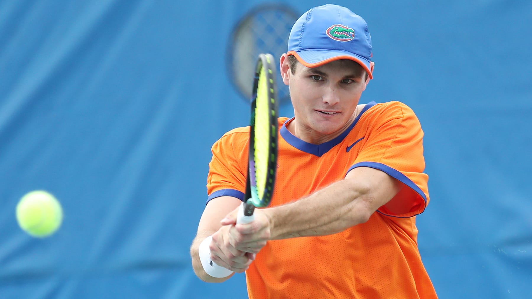 Sam Riffie swings at a ball while playing for the Florida men's tennis team in Gainesville.