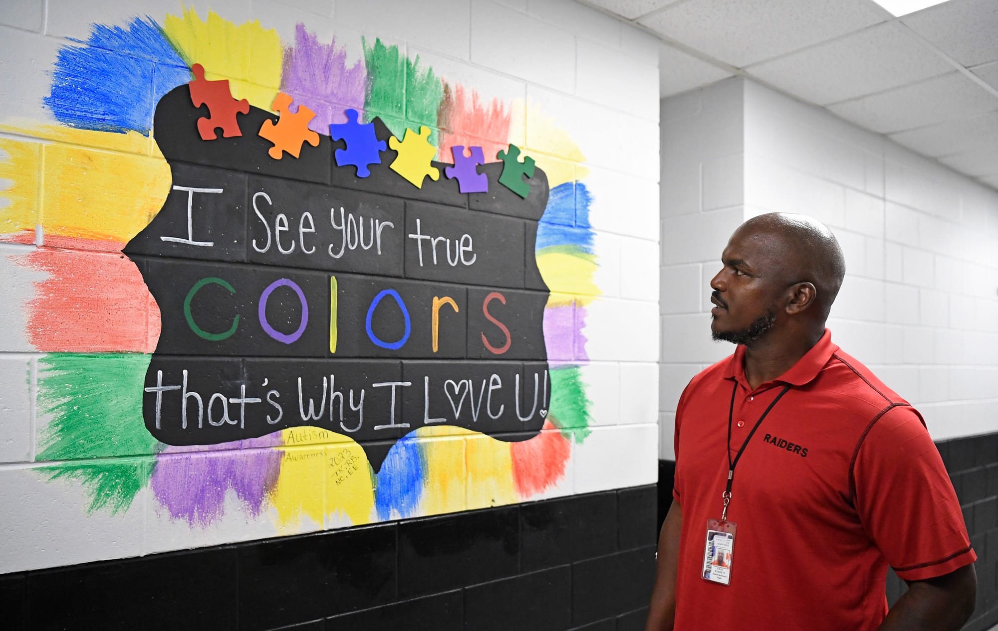 Earl Everett looks at a mural outside the ESE classroom on Monday, Sept. 14, 2026, at South Sumter High School in Bushnell, Fla.