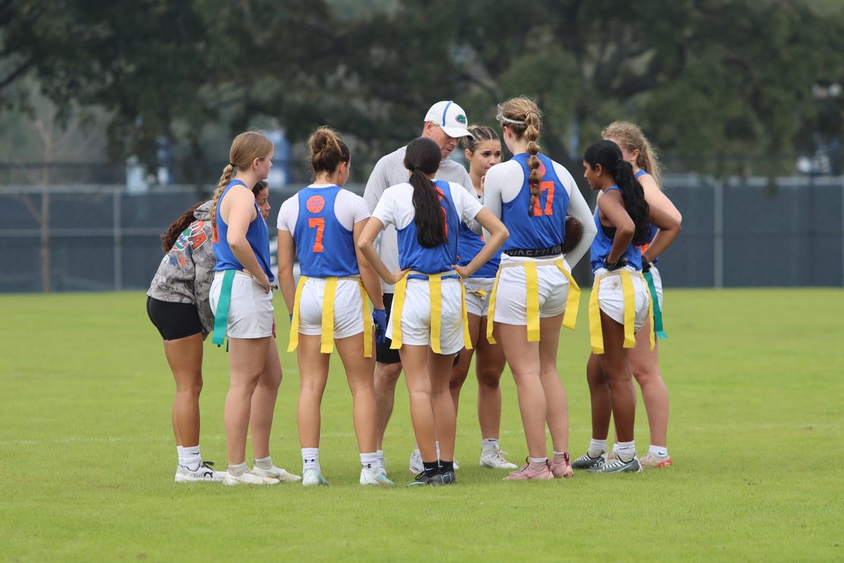 Florida's club women's flag football team huddles during a game at the National Intramural and Recreational Sports Association national championships in January 2026.
