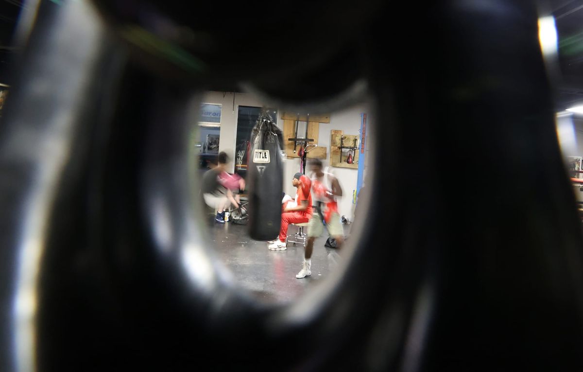 A youth boxer hits a punching bag in Galaxxy Boxing Refuge in Jacksonville on April 23.