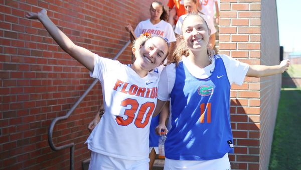 Carly and Sydney Wilson pose before a Florida lacrosse game at Dizney Stadium in Gainesville, Florida.