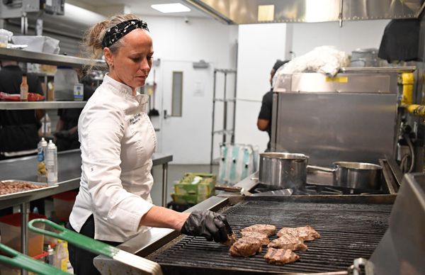 Head Chef Tonya McGowan prepares tenderloins on Tuesday, Aug. 18, 2026, at the James W. “Bill” Heavener Football Training Center in Gainesville, Fla.