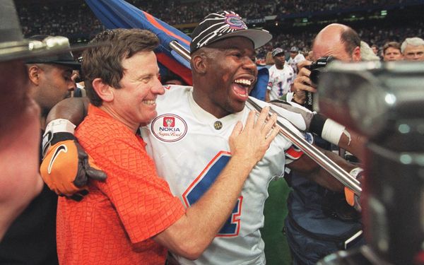 Florida Gators safety Lawrence Wright celebrates with University of Florida coach Steve Spurrier after the Gators beat Florida State for the national championship in the Sugar Bowl on January